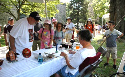 Carol Kostecki demonstrating egg decorating.