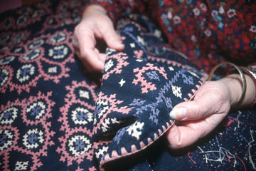 Anahid Kazazian holding a piece of Marash embroidery. Photo by Maggie Holtzberg.