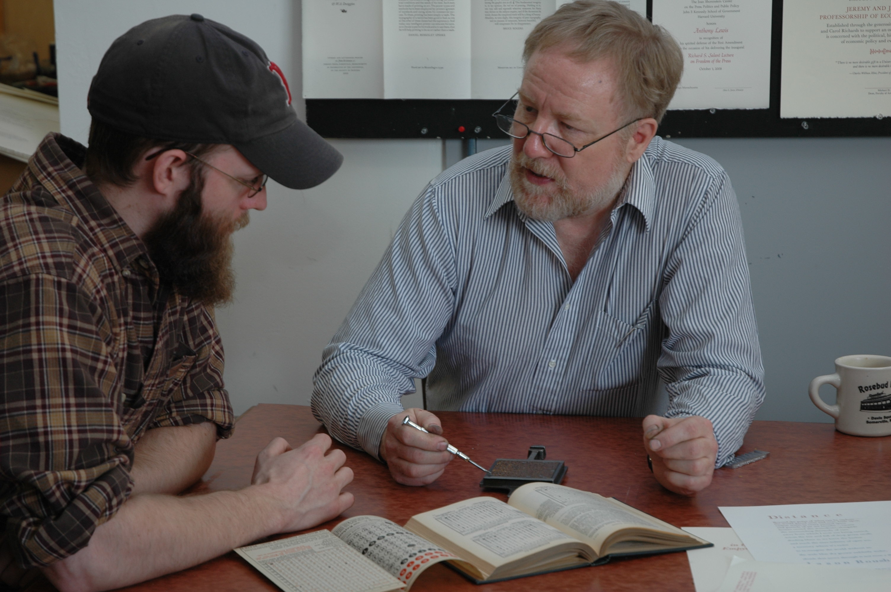 John Kristensen teaching Jesse Marsolais about the Monotype typecasting system. Photo by Maggie Holtzberg