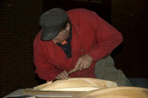Harold Burnham chiseling a half-hull model