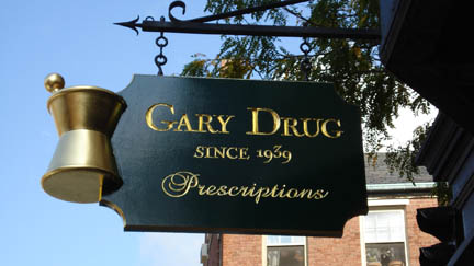 Newly hung handmade sign by Gneal Widett on Charles Street.