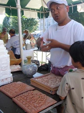 Samnang Khoeun with clay carvings of Khmer ornaments