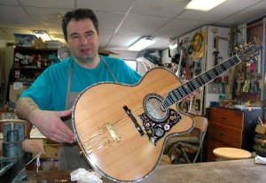 Pantazelos holding jazz guitar