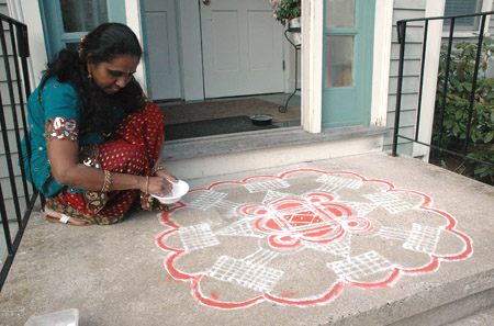 Priya working on kolam