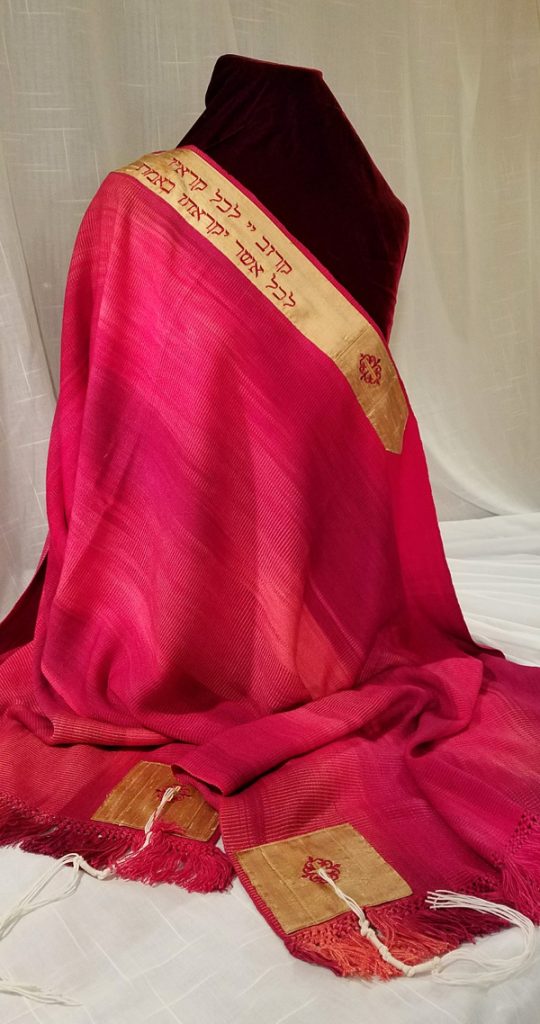 Tallit created by Amy Lassman for a Cantor in New York. The text reads "Right by the side is the Eternal to all who call out, seeking truth for all who desire it"